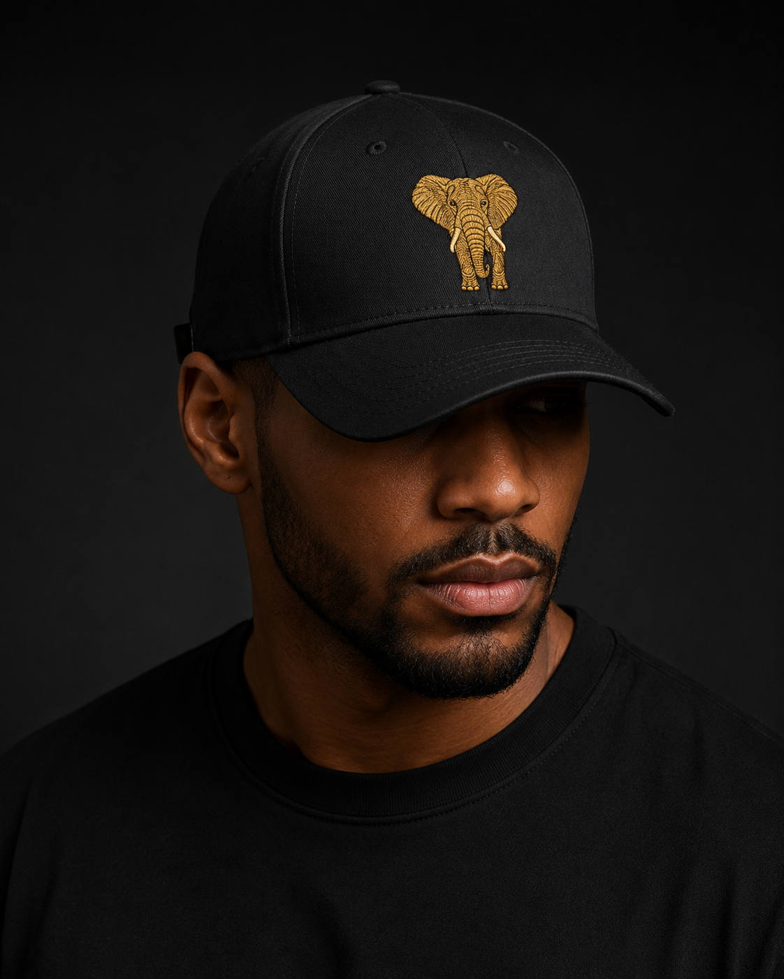 Close-up portrait of a black Royal Seriti cap with a gold elephant mark